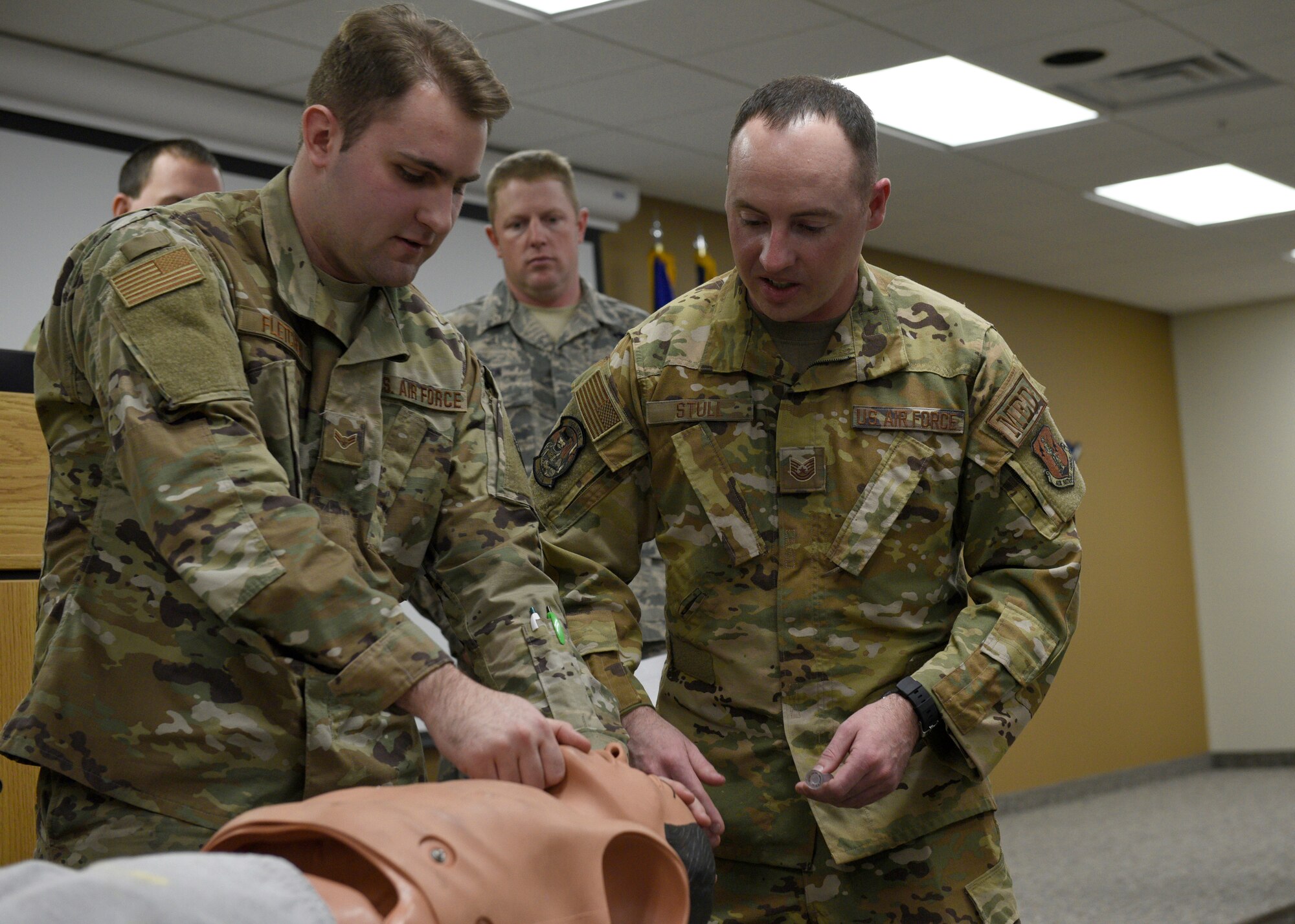 U.S. Air Force Airman 1st Class Erik Fletcher, a material management journeyman from the 120th Logistics Readiness Squadron, practices keeping a simulated patient's air passage clear during self-aid buddy care training, Jan. 4, 2020, at Great Falls, Montana.