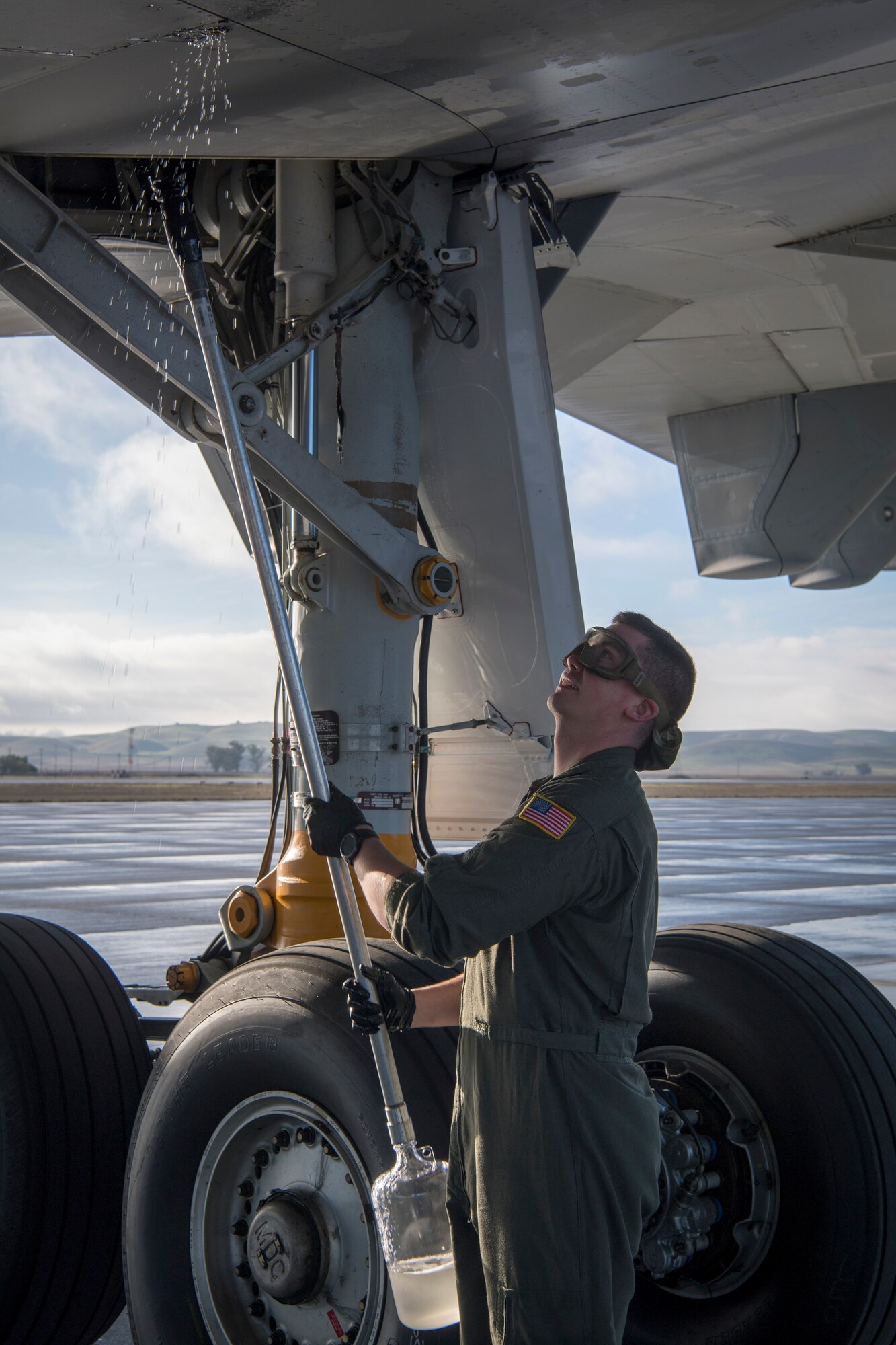 U.S. Air Force Staff Sgt. Austin Fizel, 714th Aircraft Maintenance Squadron crew chief, with the 514th Air Mobility Wing, Joint Base McGuire-Dix-Lakehurst, N.J., performs a pre-launch check on a KC-10 Extender Jan. 4, 2020. Crew chiefs from the 714th AMXS flew a sortie with members from the 78th Air Refueling Squadron to refuel the U.S. Navy Blue Angels as well as ship cargo from Travis Air Force Base, Calif., to Joint Base Pearl Harbor-Hickam, Hawaii. (U.S. Air Force photo by Senior Airman Ruben Rios)
