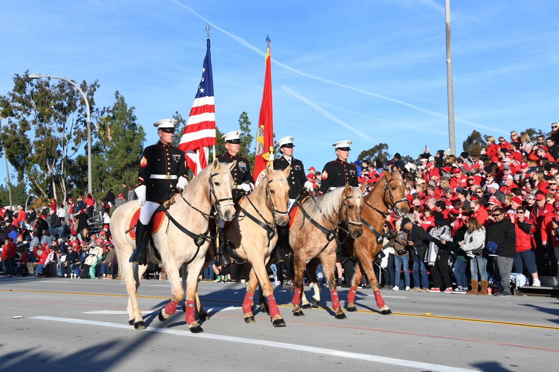 The Marine Corps Mounted Color Guard pass through the streets of Pasadena, California, during the 131st Rose Parade Jan. 1, 2020. The last remaining Marine Corps mounted color guard has participated in the annual Tournament of Roses Parade since 1985 (Marine Corps Photo by Cpl. Nathan Hall)