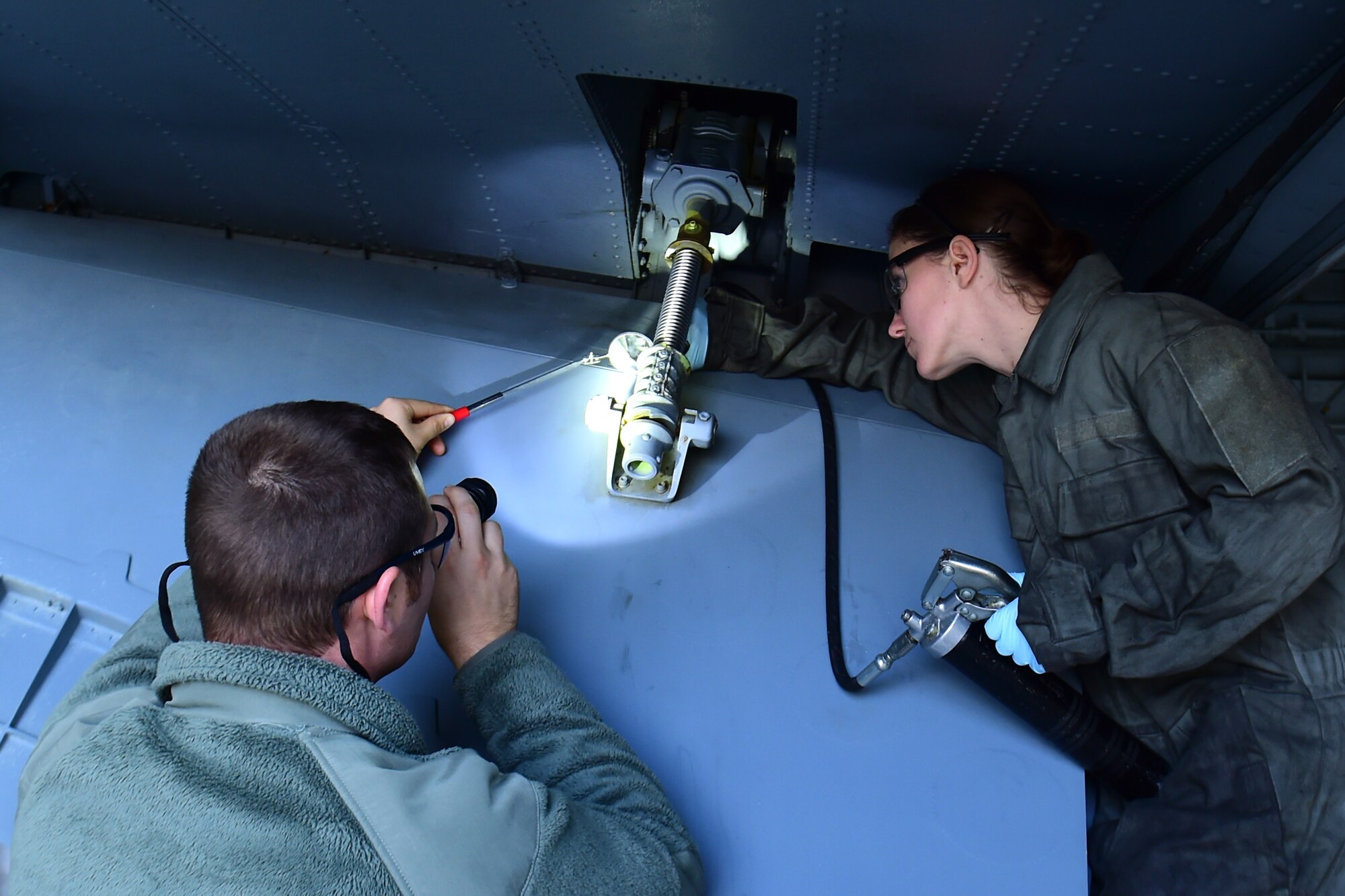 Tech. Sgt. Tanner Fye, 434th Maintenance Group quality assurance inspector, evaluates Staff Sgt. Stephanie Dimenco, 434th Maintenance Squadron isochronal crew chief, during her performance evaluation for critical lubrication items at Grissom Air Reserve Base, Indiana, Nov. 3, 2019.   For the first time since the base’s realignment as a Reserve base in 1994, the 434th Maintenance Group has converted seven air reserve technician positions to straight civilian positions.  (U.S. Air Force photo by Staff Sgt. Chris Massey)