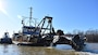 IN THE PHOTO, the Inland Dredging Company’s cutterhead dredge “Integrity,” along with one of its small tugboats, works to dredge the Memphis Harbor/McKellar Lake, which was the last of 10 harbors dredged in the Memphis District during 2019. (USACE photo/Jessica Haas)