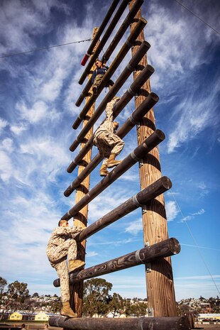 Recruits with Lima Company, 3rd Recruit Training Battalion, overcome an obstacle during the confidence course at Marine Corps Recruit Depot, San Diego, Dec. 17, 2019.