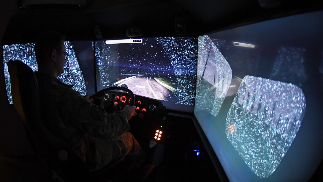 Staff Sgt. Andrew Bagley, training validation and operation NCOIC in the 75th Logistics Readiness Squadron, practices night driving in snowy conditions with the unit's new vehicle training simulator. Drivers can use the state-of-the-art simulator to train for nearly any driving condition imaginable and on nearly 30 different vehicles.  (U.S. Air Force photos by Cynthia Griggs)