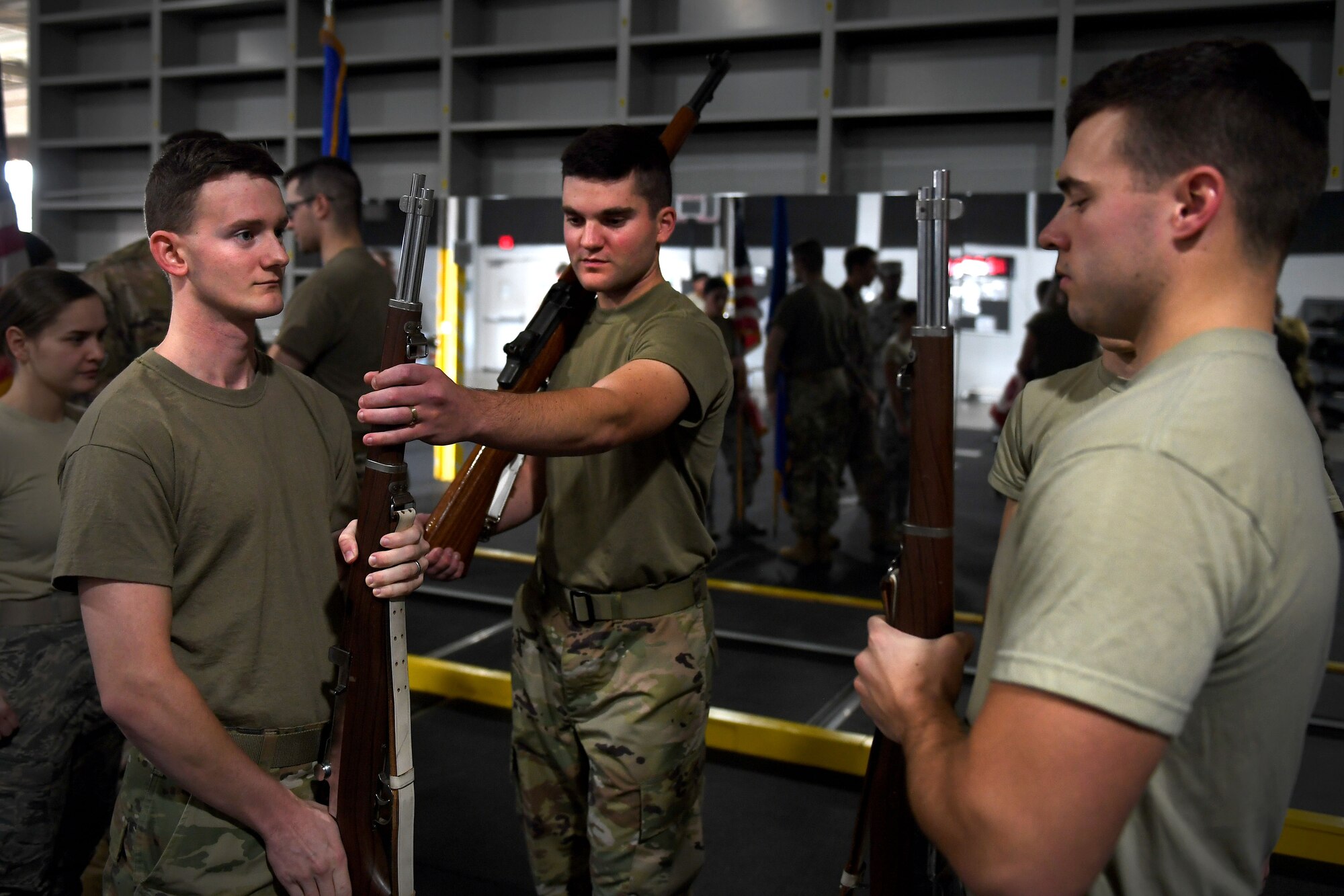 People practice honor guard.