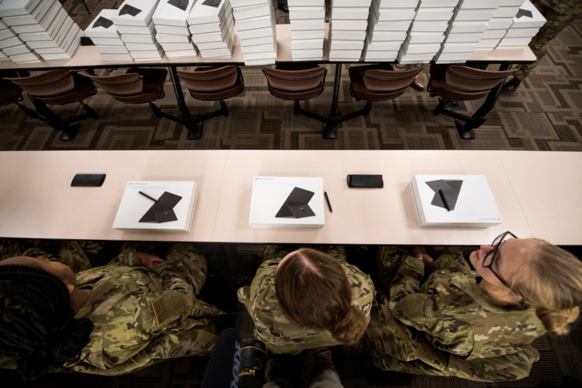 U.S. Air Force basic military training trainees are issued personal computers during in-processing as part of a pilot test under a Cooperative Research and Development Agreement partnership at Joint Base San Antonio-Lackland, Texas, Dec. 11, 2019. The computers replace all hard copy textbooks BMT trainees currently use with the intent to help BMT assess learning outcomes, value and return on investment. (U.S. Air Force photo by Sarayuth Pinthong)