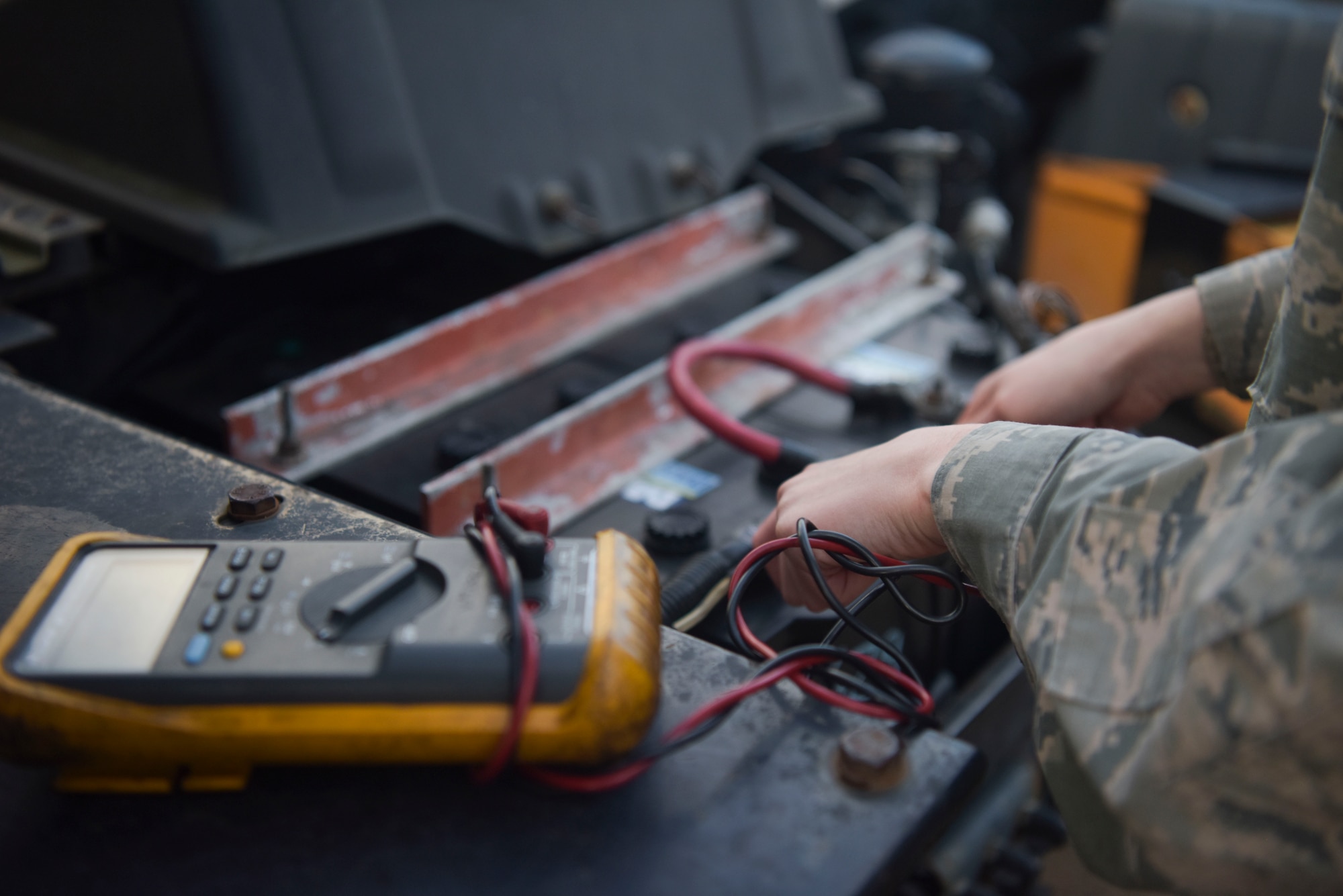 Staff Sgt. Garrison West, 100th Logistics Readiness Squadron mission generating vehicle equipment maintenance supervisor, checks the battery box of a semi-truck assigned to the 100th LRS, Jan. 6, 2019, at RAF Mildenhall, England. The vehicle maintenance shop keeps the daily maintenance up-to-date on the all the vehicles assigned to the 100th LRS ranging from oil changes and battery checks to tire replacements. (U.S. Air Force photo by Senior Airman Alexandria Lee)