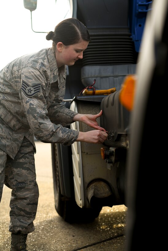 Staff Sgt. Garrison West, 100th Logistics Readiness Squadron mission generating vehicle equipment maintenance supervisor, opens the battery box of a semi-truck assigned to the 100th LRS, Jan. 6, 2019, at RAF Mildenhall, England. The vehicle maintenance shop keeps the daily maintenance up-to-date on the all the vehicles assigned to the 100th LRS ranging from oil changes and battery checks to tire replacements. (U.S. Air Force photo by Senior Airman Alexandria Lee)