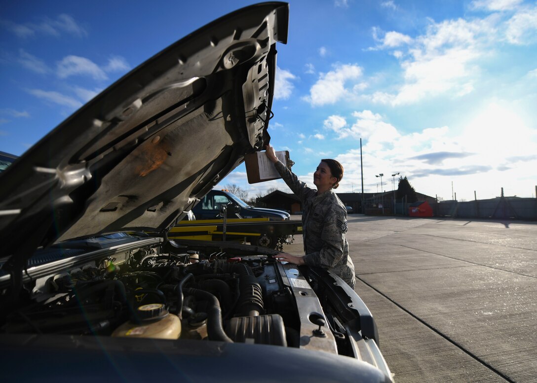 Staff Sgt. Garrison West, 100th Logistics Readiness Squadron mission generating vehicle equipment maintenance supervisor, checks under the hood of a truck, Jan. 6, 2019, at RAF Mildenhall, England. The 100th LRS vehicle maintenance shop performs the daily maintenance up-to-date on the all the vehicles assigned to the 100th LRS ranging from oil changes and battery checks to tire replacements. (U.S. Air Force photo by Senior Airman Alexandria Lee)