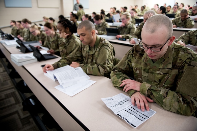 U.S. Air Force basic military training trainees are issued personal computers during in-processing as part of a pilot test under a Cooperative Research and Development Agreement partnership at Joint Base San Antonio-Lackland, Texas, Dec. 11, 2019. The computers replace all hard copy textbooks BMT trainees currently use with the intent to help BMT assess learning outcomes, value and return on investment. (U.S. Air Force photo by Sarayuth Pinthong)