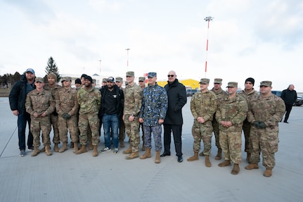 Service members at Mihail Kognalniceanu Air Base, Romania, greet USO Talent as they arrive as part of the Chairman's USO New Year's Tour 2020, Jan. 6, 2020. Vice Chairman of the Joint Chiefs of Staff Gen. John E. Hyten and Senior Enlisted Advisor to the Chairman Ramon "CZ" Colon-Lopez host the Chairman's USO Tour on behalf of Chairman of the Joint Chiefs of Staff Gen. Mark A. Milley to bring Washington Nationals Aaron Barrett and Adam Eaton, comedians Scott Armstrong and Matt Walsh, actor Brad Morris, country music band LoCash, MMA Fighters Illima-Lei Macfarlane and Felice Herrig; and DJ J Dayz to show service members in the U.S. European area of responsibility that America remembers them and values their service.