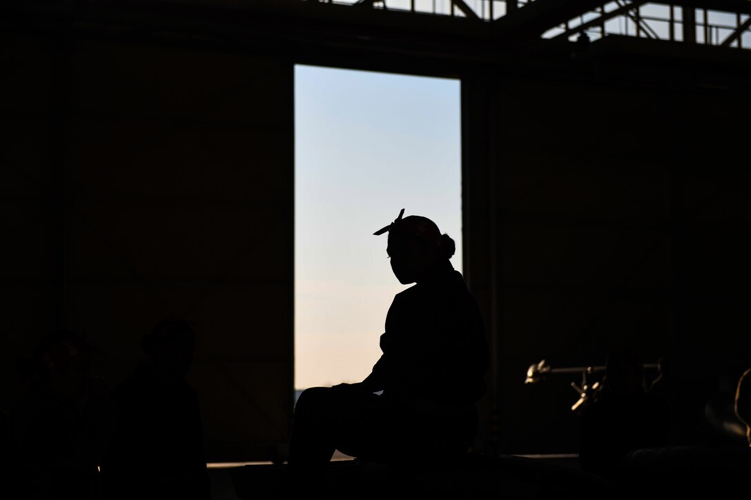 A U.S Airman from the 31st Munition Squadron sits and prepares for the Rapid Aircraft Generation and Employment competition to begin at Aviano Air Base, Italy, Jan. 7, 2020. The Airman was part of the “Bouncing Bettys” team, which consisted of six females. The team competed in six evaluated events, a written test, stockpile practices, trailer configuration, trailer re-configuration, 463L palletization and a weapons build. (U.S. Air Force photo by Airman 1st Class Ericka A. Woolever).