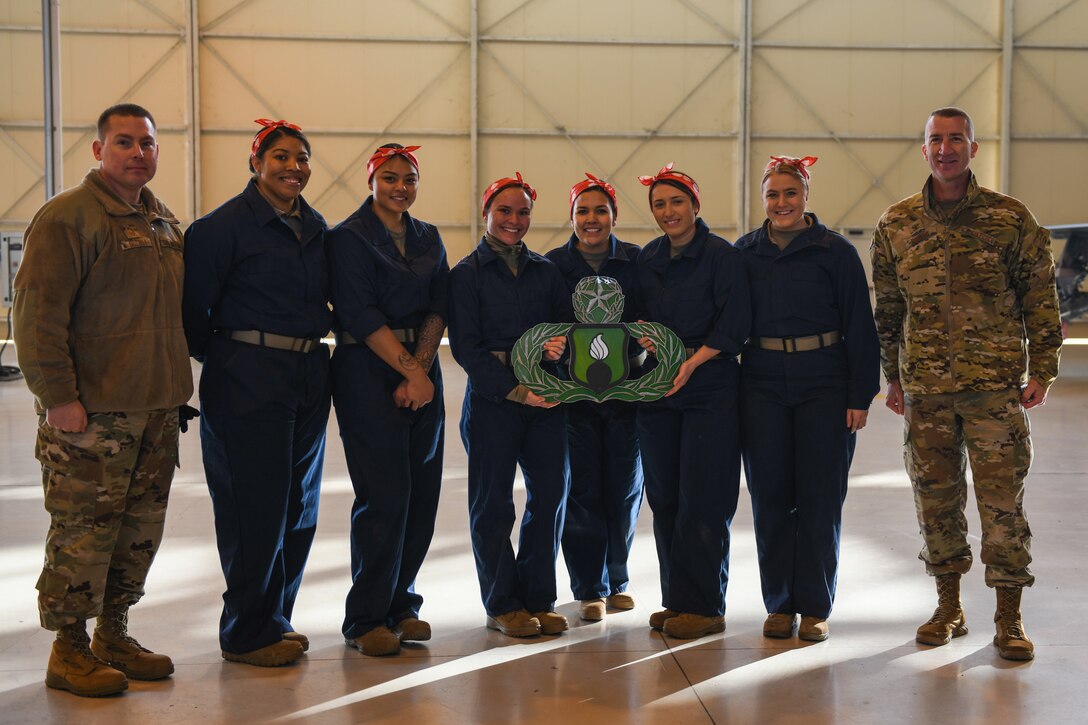U.S Airmen from the 31st Munition Squadron and the 731st Munition Squadron and leadership pose for a photo at compete at Aviano Air Base, Italy, Jan. 7, 2020. The “Bouncing Bettys” team had a higher overall score and will have their names etched on plaques, which will be added to the 31st MUNS heritage. (U.S. Air Force photo by Airman 1st Class Ericka A. Woolever).