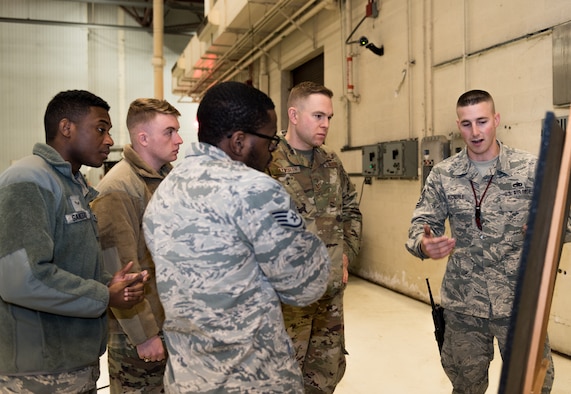 Maintenance Airmen with the 131st and the 509th Bomb Wings at Whiteman Air Force Base, Missouri, discuss improved maintenance phase inspection process on Dec. 11, 2019. The Airmen explained their findings as part of the Phase Innovation Showcase which consisted of five stations that Airmen rotated through to learn about the new 14-day phase inspection. (U.S. Air Force photo by Airman 1st Class Christina Carter)