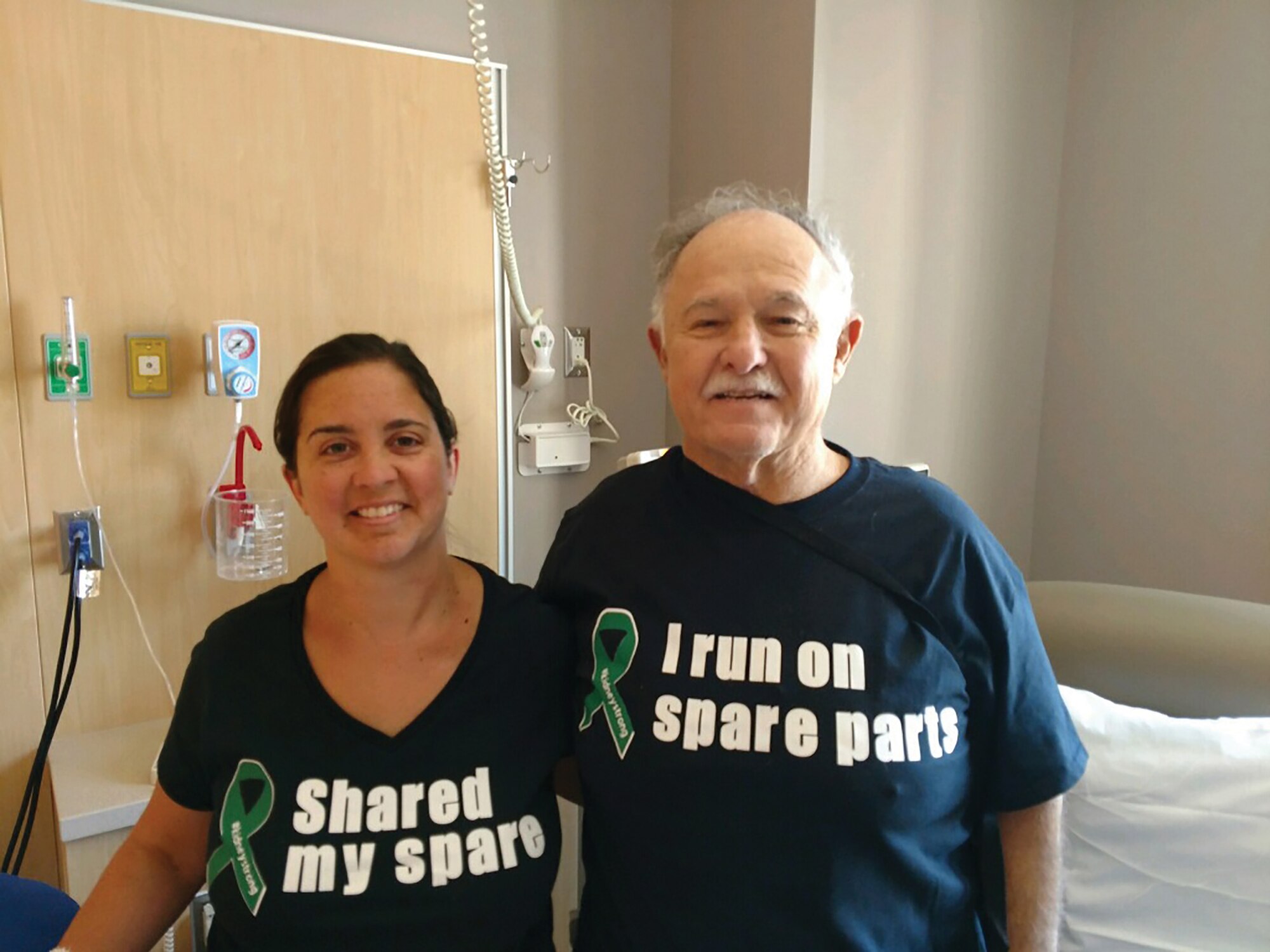 Staff Sgt. Melissa Sherman, 445th Aerospace Medicine Squadron, poses for a photo with her father, Gary Meager an hour after they both underwent kidney transplant surgery at Banner-University Medical Center in Phoenix, Arizona, July 17, 2019.