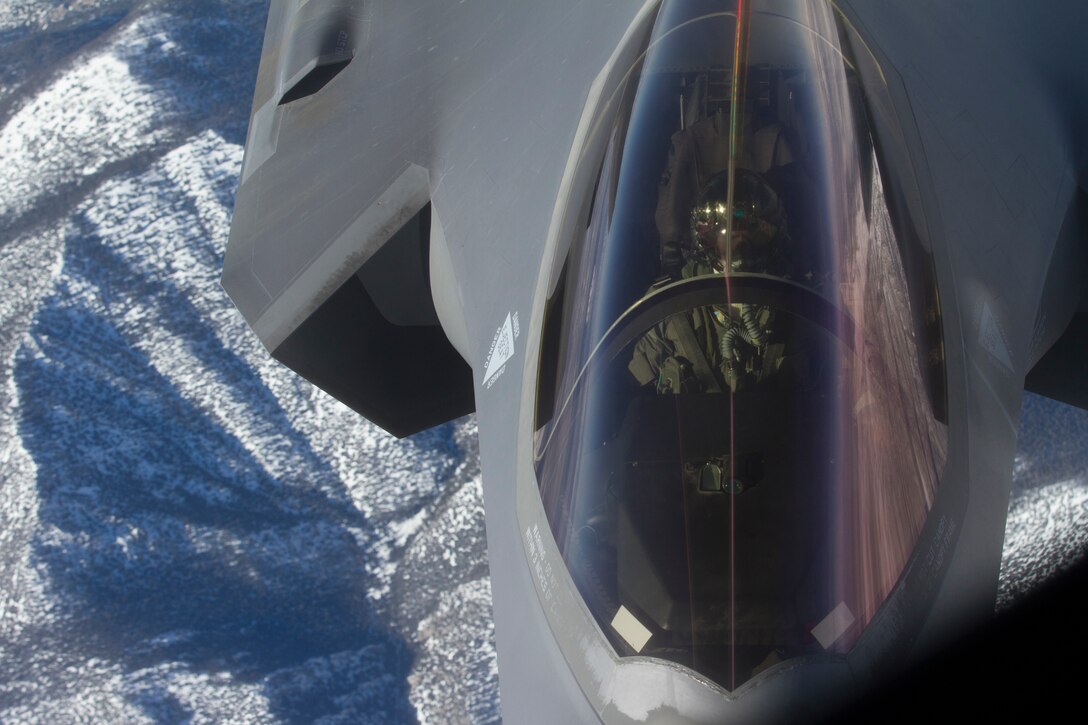 A look down at a pilot inside the cockpit of an F-35.