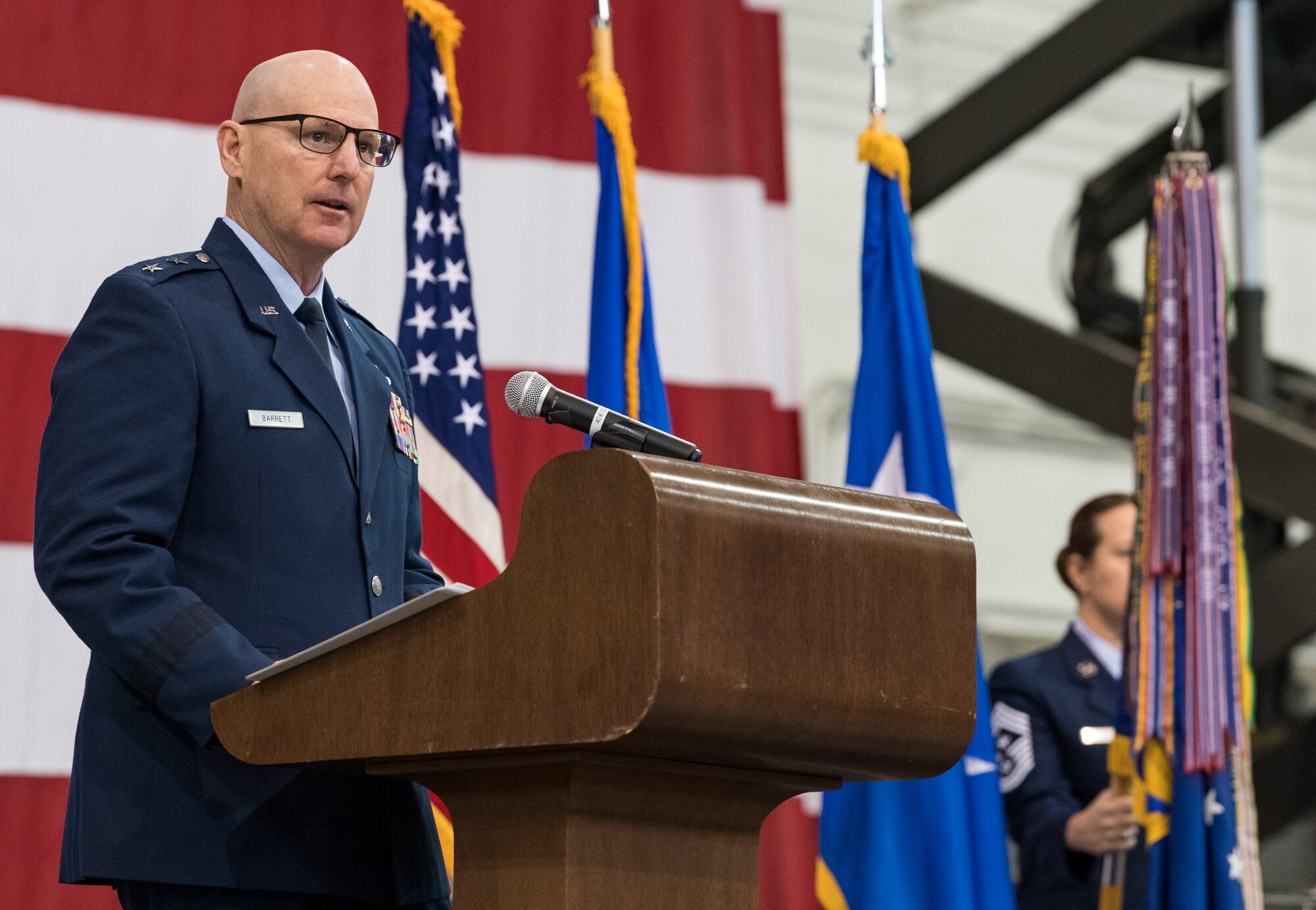 Maj. Gen. Sam C. Barrett, 18th Air Force commander, speaks to Team Dover members, friends and family, guests, civic leaders and congressional delegates in attendance during the 436th Airlift Wing Change of Command ceremony Jan. 7, 2020, inside the 436th Aerial Port Squadron, on Dover Air Force Base, Del. Barrett presided over the ceremony in which Col. Joel Safranek relinquished command to Col. Matthew Jones. Jones became the wing’s 35th commander (U.S. Air Force photo by Roland Balik)