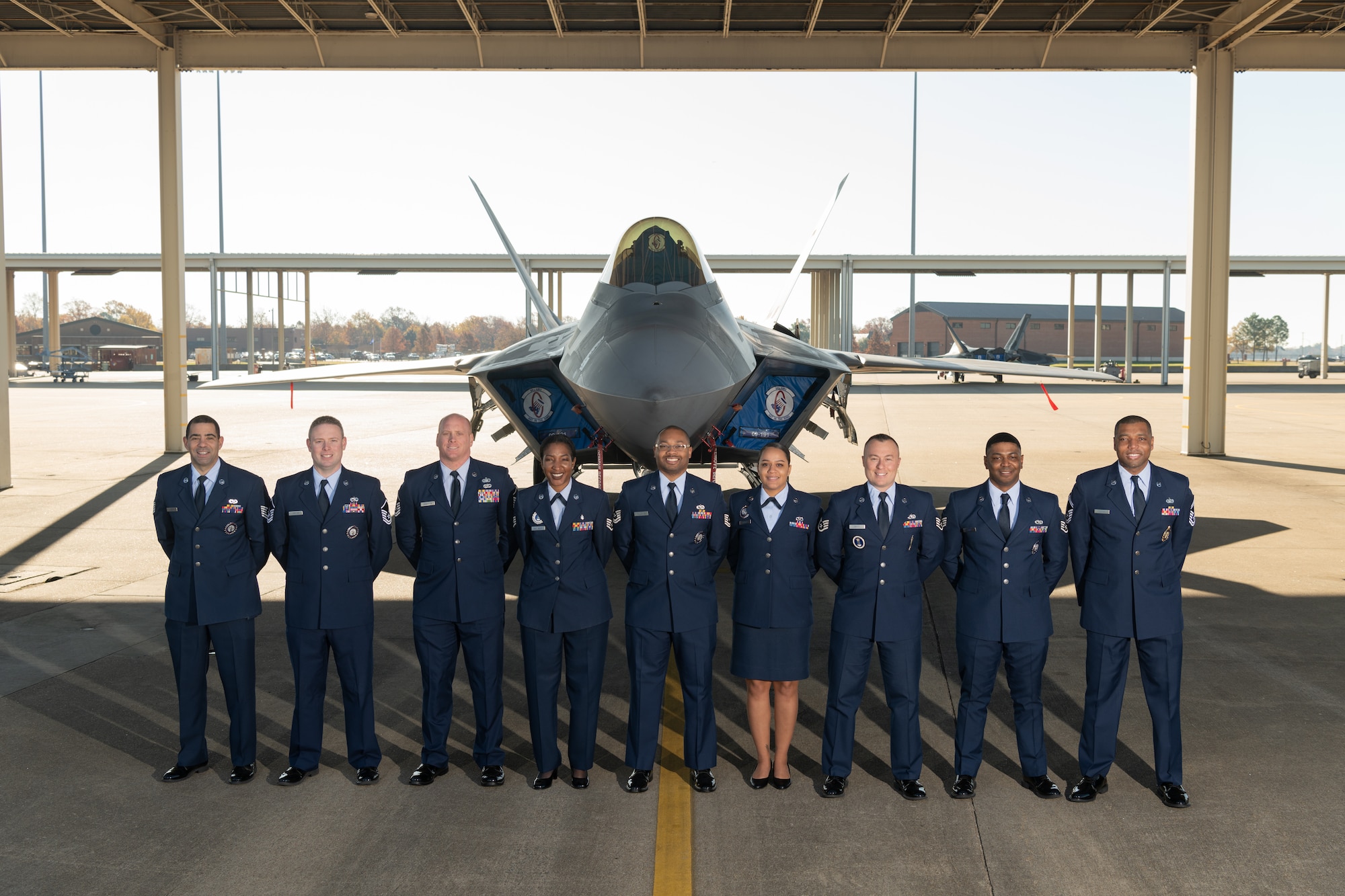 Group photo of Airmen in front of a jet