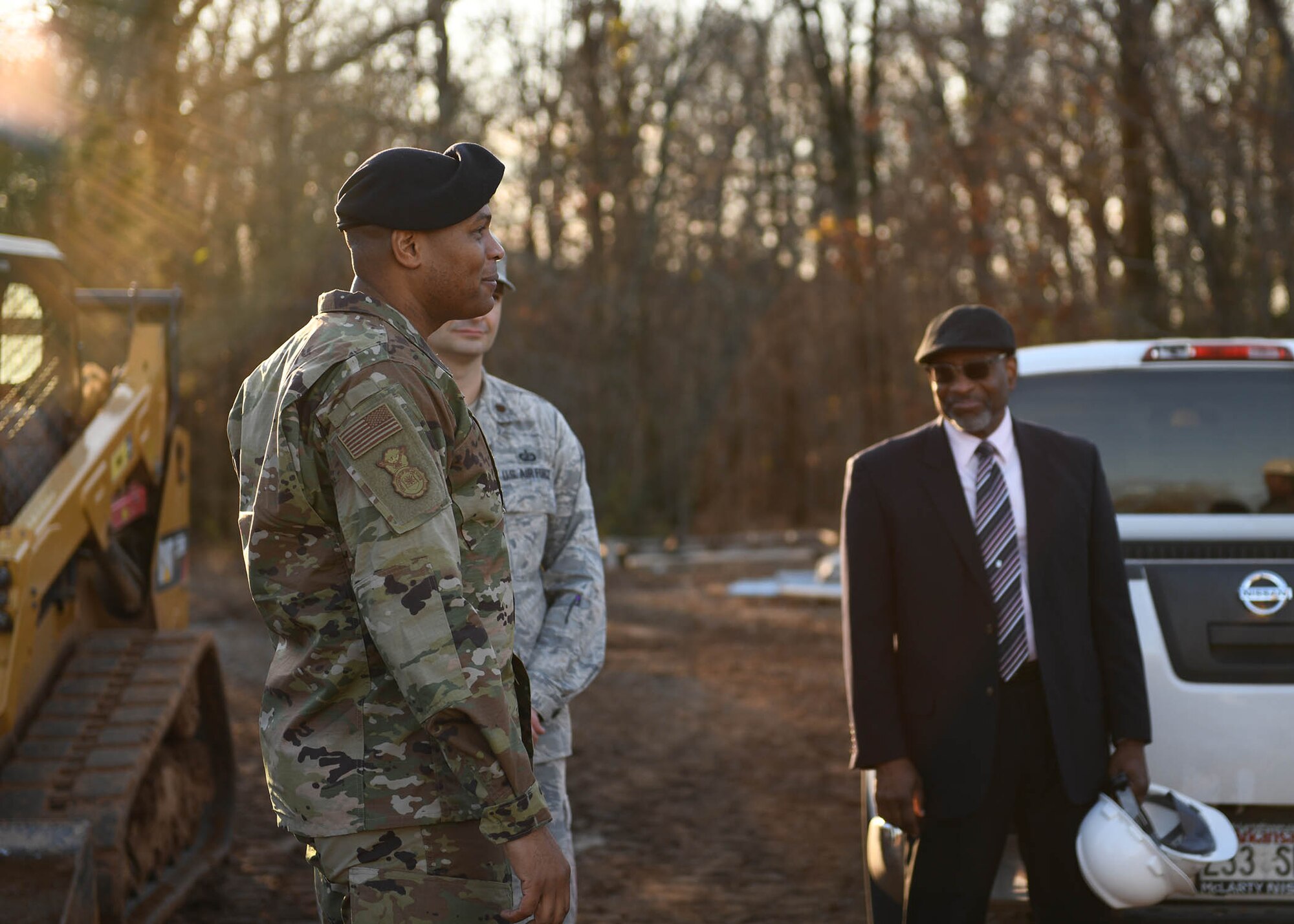 An Airman looks at a building.