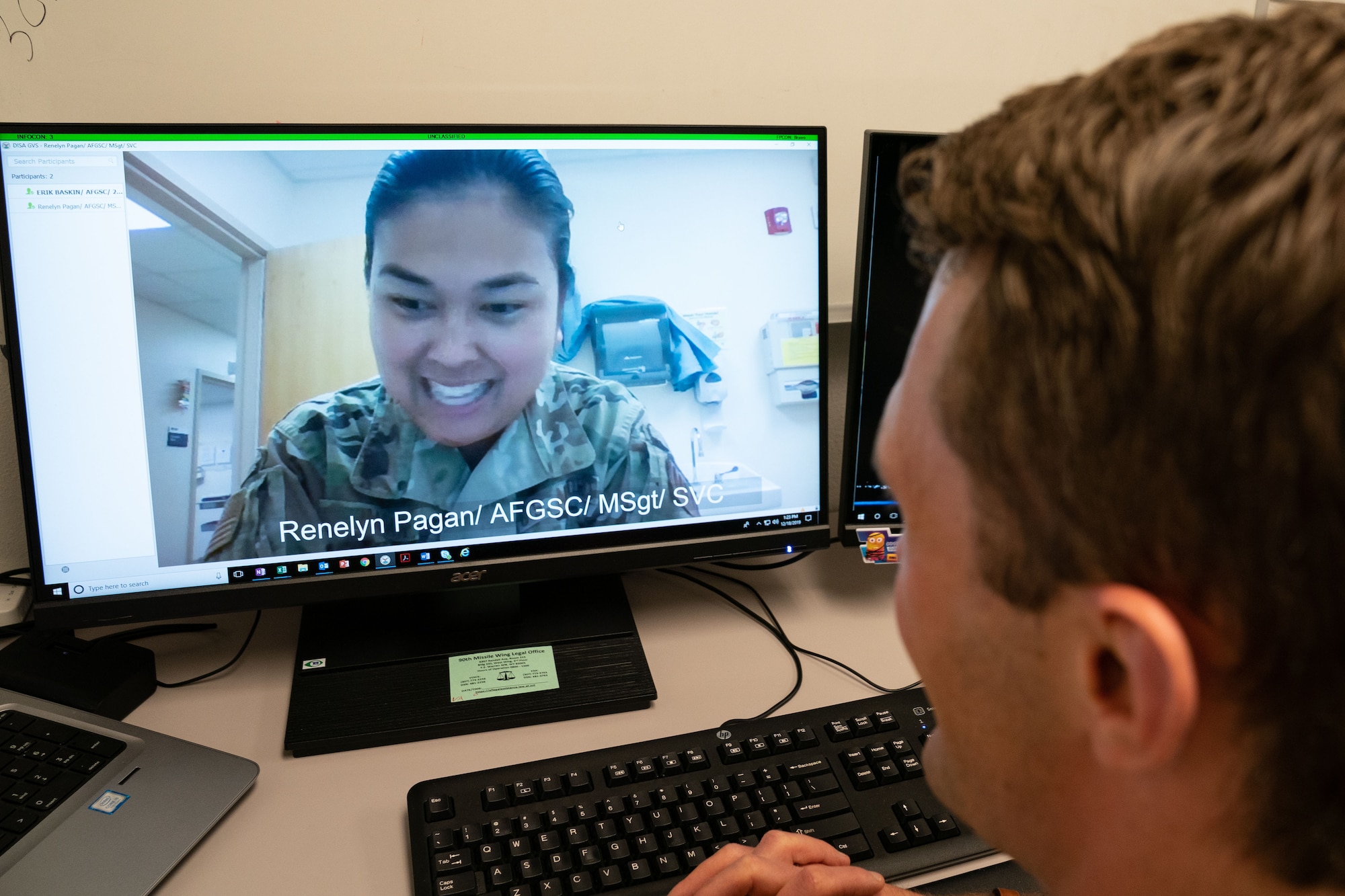 2nd Lt. Erik Baskin, Systems Flight commander, 90th Health Care Operations Squadron, and Master Sgt. Renelyn Pagan, Operational Medicine flight chief, 90th Operations Medical Readiness Squadron, demonstrate how the new video medical care system will work. Maj. Michael Vernale, Mental Health Flight commander worked with the 90th Missile Wing LaunchWERX agency to launch the idea as part of an ongoing effort to innovate the Air Force to meet the demands of tomorrow. The plan is to install the capability in each missile alert facility. (U.S. Air Force photo by Joseph Coslett)