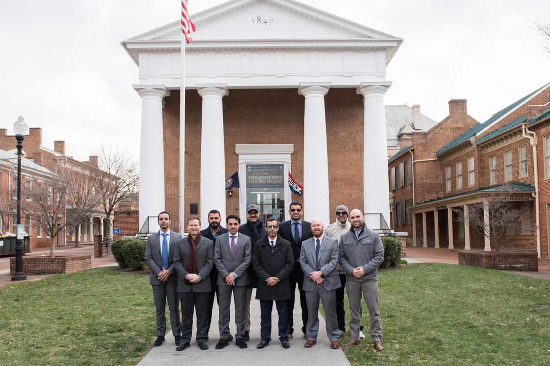 Members of the Kuwaiti Military Engineering Projects Office and program managers from the U.S. Army Corps of Engineers Middle East District pose for a photo outside the historic courthouse in Winchester, VA where the District headquarters is located.