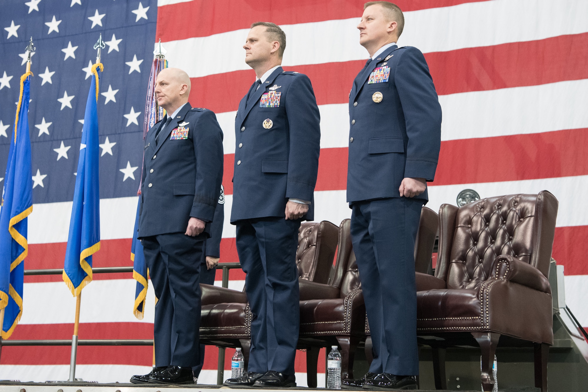 From left, Maj. Gen. Sam C. Barrett, 18th Air Force commander, Col. Joel Safranek, outgoing 436 Airlift Wing commander and  Col. Matthew Jones, incoming 436th AW commander, stand at
attention during the 436th AW Change of Command ceremony
Jan 7, 2020, at Dover Air Force Base, Del. Safranek relinquished command to Jones in a ceremony attended by friends, family, members of Team Dover, local civic leaders and distinguished visitors. (U.S. Air Force photo by Mauricio Campino)