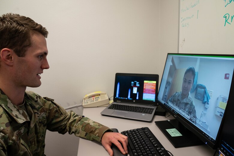 2nd Lt. Erik Baskin, Systems Flight commander, 90th Health Care Operations Squadron, and Master Sgt. Renelyn Pagan, Operational Medicine flight chief, 90th Operations Medical Readiness Squadron, demonstrate how the new video medical care system will work. Maj. Michael Vernale, Mental Health Flight commander worked with the 90th Missile Wing LaunchWERX agency to launch the idea as part of an ongoing effort to innovate the Air Force to meet the demands of tomorrow. The plan is to install the capability in each missile alert facility. (U.S. Air Force photo by Joseph Coslett)