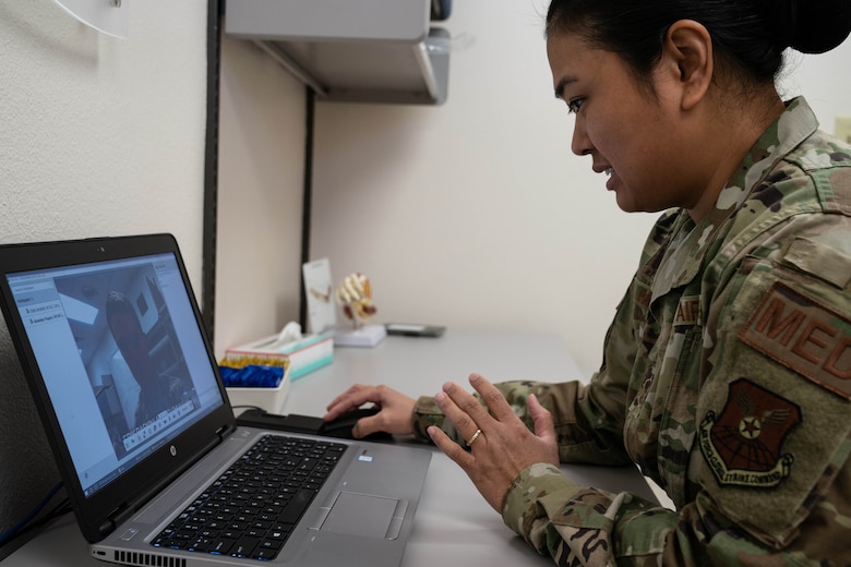 Master Sgt. Renelyn Pagan, Operational Medicine flight chief, 90th Operations Medical Readiness Squadron, and 2nd Lt. Erik Baskin, Systems Flight commander, 90th Health Care Operations Squadron,demonstrate how the new video medical care system will work. Maj. Michael Vernale, Mental Health Flight commander worked with the 90th Missile Wing LaunchWERX agency to launch the idea as part of an ongoing effort to innovate the Air Force to meet the demands of tomorrow. The plan is to install the capability in each missile alert facility. (U.S. Air Force photo by Joseph Coslett)