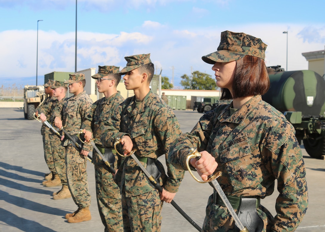 U.S. Marines with Special Purpose Marine Air-Ground Task Force - Crisis Response - Africa 20.1, Marine Forces Europe and Africa, practice sword manual as they attend Corporal’s Course in Sigonella, Italy, Dec. 30, 2019. SPMAGTF-CR-AF is deployed to conduct crisis-response and theater-security operations in Africa and promote regional stability by conducting military-to-military training exercises throughout Europe and Africa. (U.S. Marine Corps photo by 2nd Lt. Grace Jenkins)