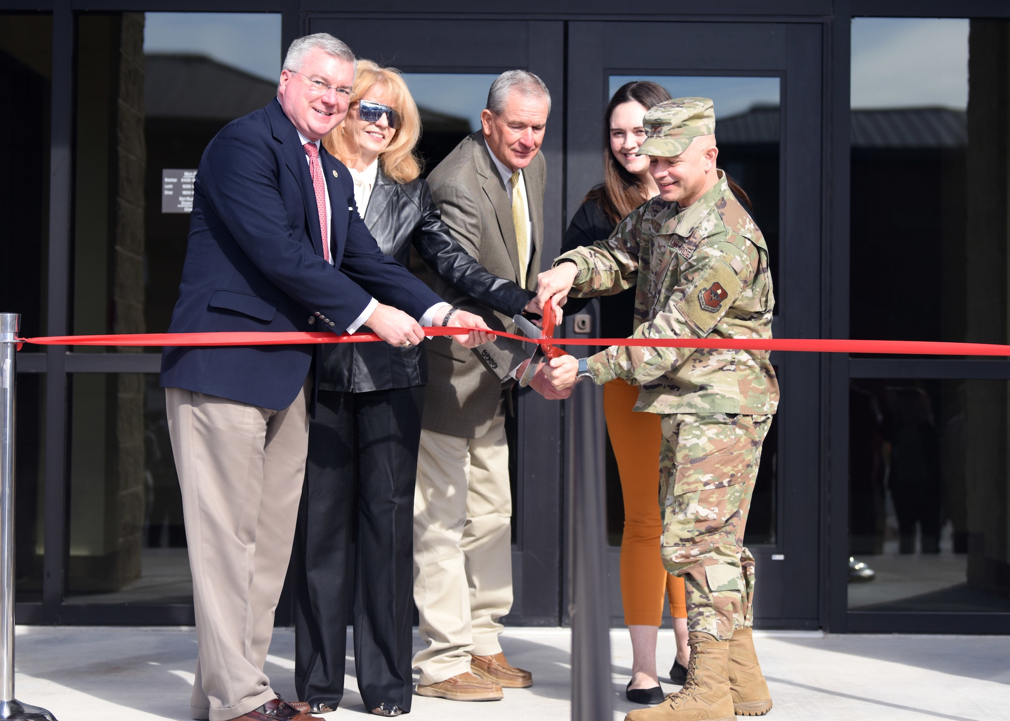 Officials from San Angelo, Texas and Goodfellow Air Force Base cut the ribbon to officially open the new multi-purpose Cressman Dining Facility on Goodfellow Air Force Base, January 6, 2020. The project was the result of years of planning, design and construction with the involvement of many people at different levels. (U.S. Air Force photo by Airman 1st Class Ethan Sherwood)