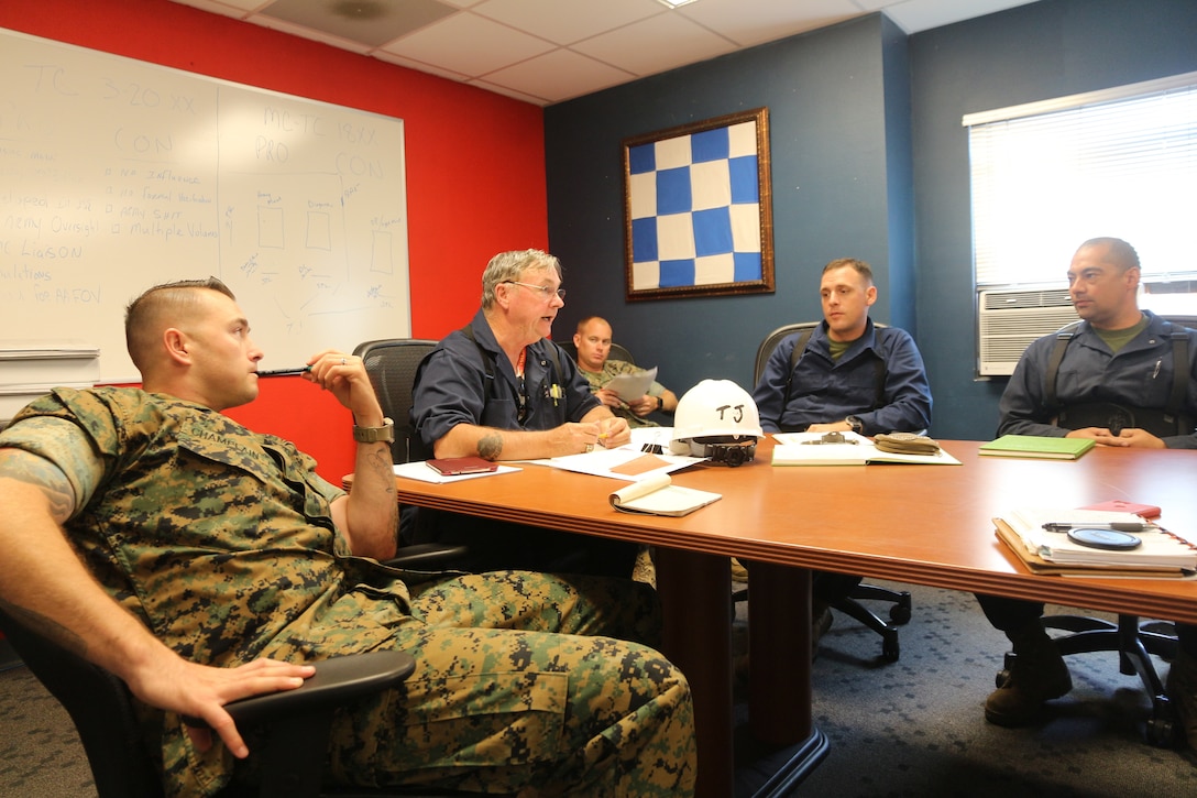 Tommy “TJ” Pittman reviews changes made to technical manuals during the logistics demonstration with Staff Sgt. Matthew Champlain, Gunnery Sgt.