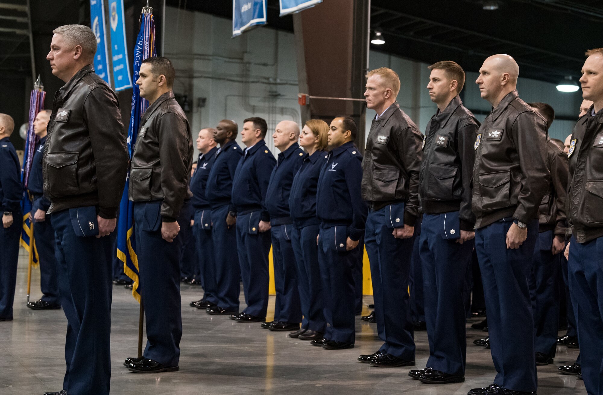 Team Dover members stand in formation during the 436th Airlift Wing Change of Command ceremony Jan. 7, 2020, inside the 436th Aerial Port Squadron on Dover Air Force Base, Del. During the ceremony, Col. Joel Safranek relinquished command to Col. Matthew Jones. (U.S. Air Force photo by Roland Balik)