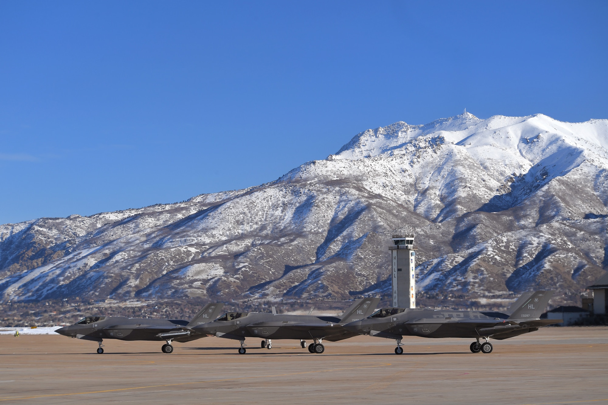F-35 Lightning II fighter jets assigned to Hill Air Force Base, Utah, prepare to taxi during a combat power exercise