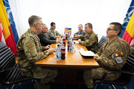 Vice Chairman of the Joint Chiefs of Staff Gen. John E. Hyten meets with Romanian Chief of the Defense Staff Lt. Gen. Daniel Petrescu during a visit to Mihail Kognalniceanu Air Base, Romania, as part of the Chairman's USO New Year's Tour 2020, on Jan. 7, 2020.