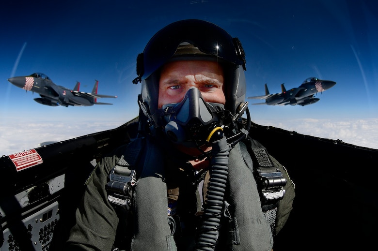 Photojournalist takes a selfie while documenting two F-15E Strike Eagles and an F-15C Eagle