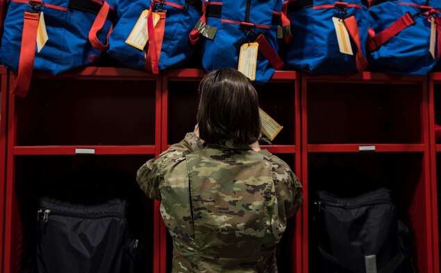 Photo of Airman putting labels on lockers