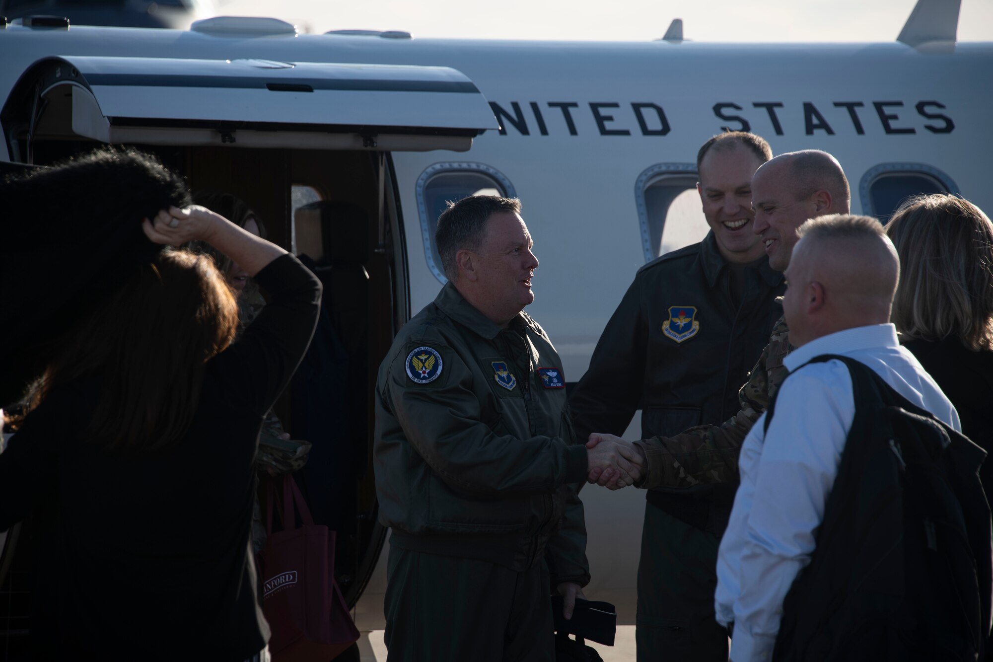 U.S. Air Force Col Matthew Leard, commander of the 97th Air Mobility Wing, and Chief Master Sgt. Randy Kay II, command chief of the 97th AMW, greets Lt. Gen. Brad Webb, commander of Air Education and Training Command,