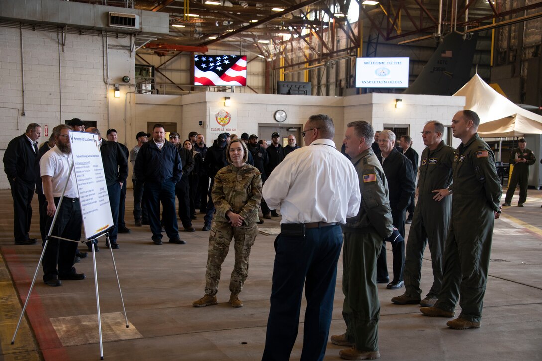 U.S. Air Force Chief Master Sgt. Julie Gudgel, command chief of Air Education and Training Command, and Lt. Gen. Brad Webb, commander of AETC are shown how the 97th Maintenance Group has collaborated with the community to recruit maintainers.