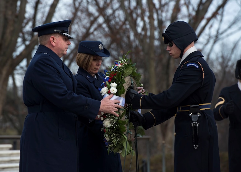 Air Force Office of Special Investigations Commander, Brig. Gen. Terry L. Bullard and Command Chief Master Sgt. Karen F. Beirne-Flint present the AFOSI wreath to a member of the 3rd Infantry Regiment (The Old Guard) for placement at the Tomb of the Unknown Soldier at Arlington National Cemetery, Va., Jan. 7, 2020.  (U.S. Air Force photo by Staff Sgt. Jeremy Mosier, SAF/PAI)