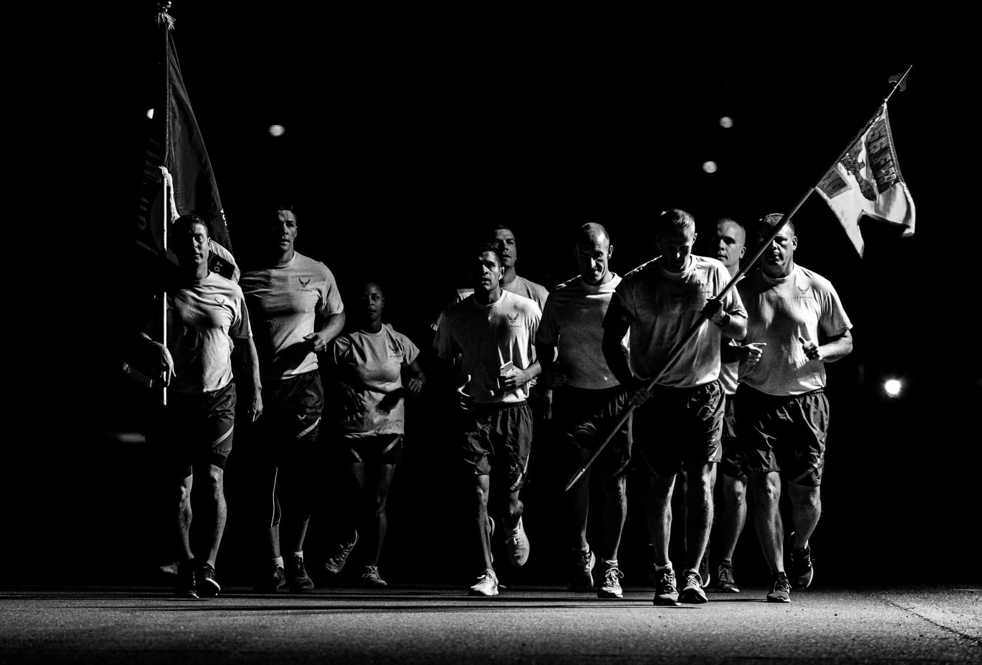 Airmen honor former prisoners of war and those listed as missing in action during a 24-hour vigil run