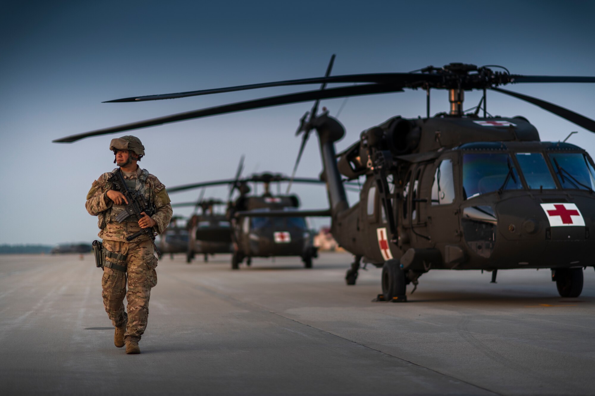 Security forces specialist walks the flightline