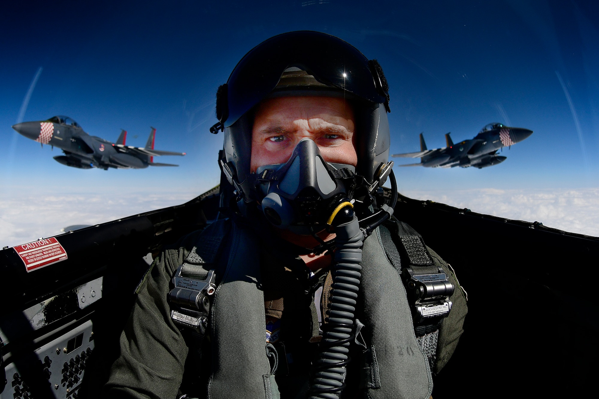 Photojournalist takes a selfie while documenting two F-15E Strike Eagles and an F-15C Eagle