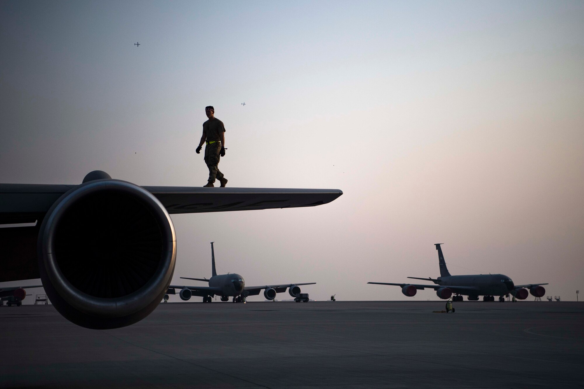 Airman performs post-flight inspections on a KC-135 Stratotanker