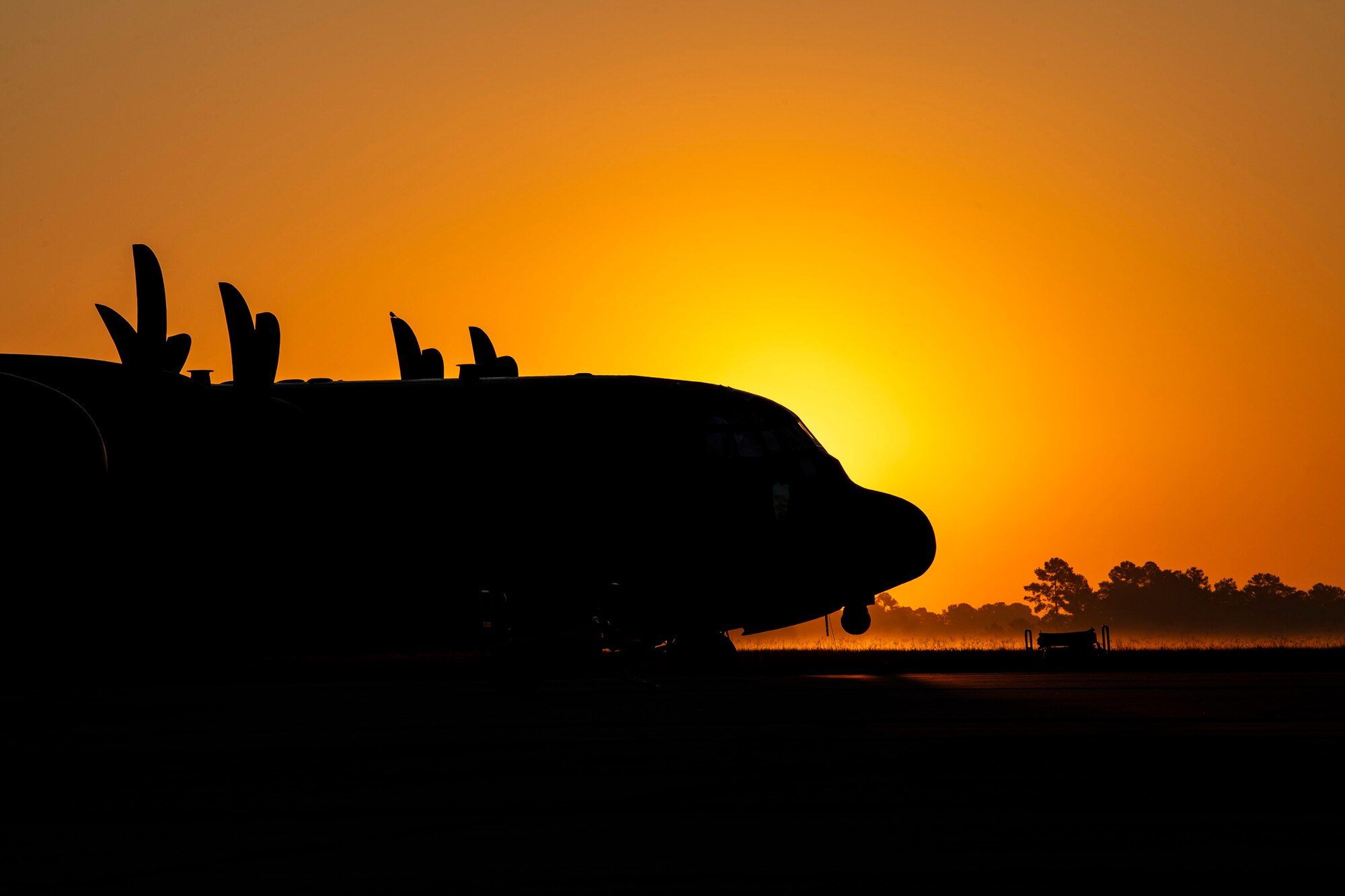 An HC-130J Combat King II parked on the flightline