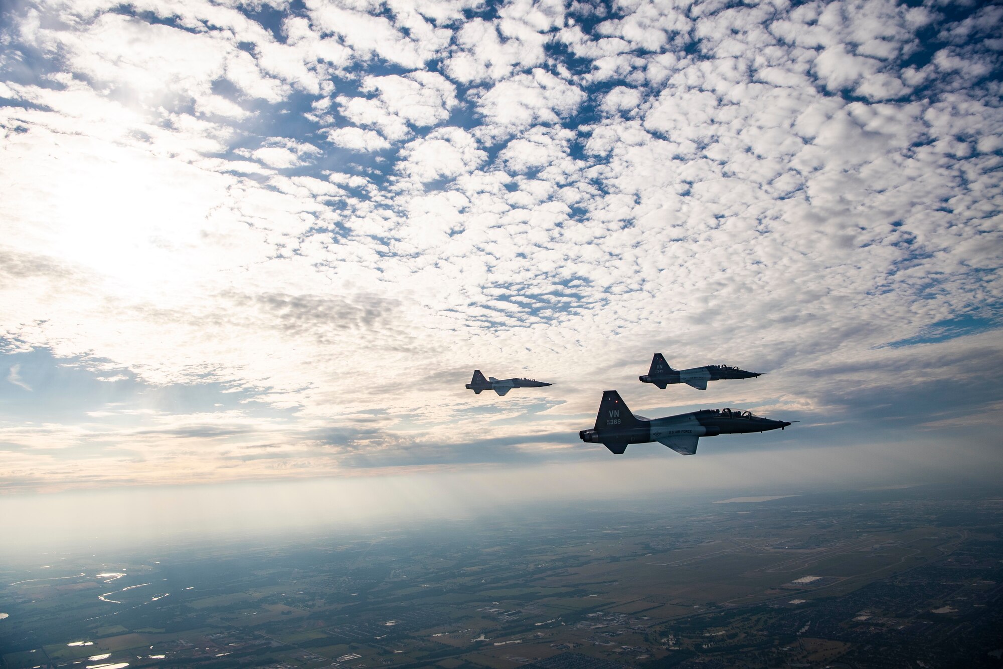 Pilots soar through the sky in a T-38C Talon