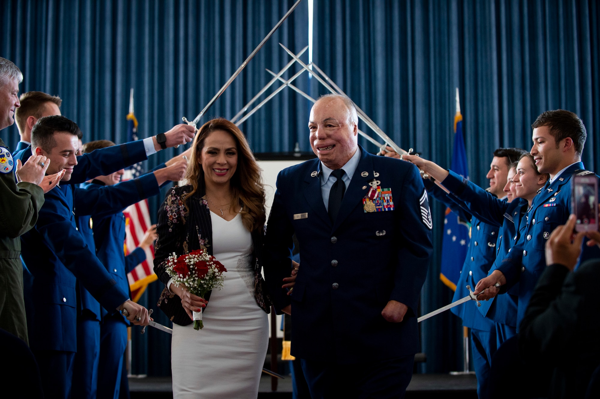Senior Master Sgt. Israel Del Toro and his wife, Carmen, renew their wedding vows during his retirement ceremony