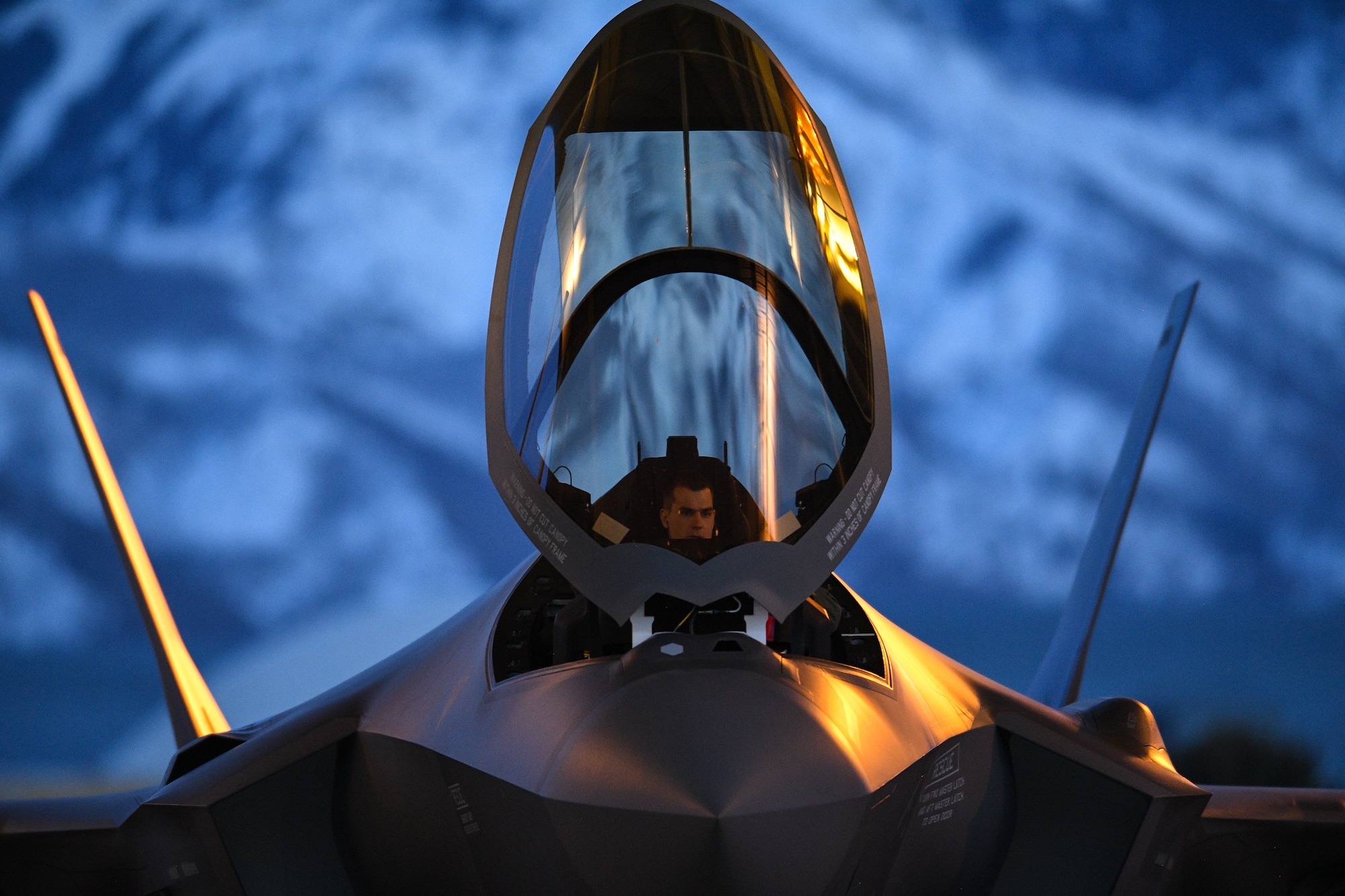 A pilot prepares to launch an F-35A Lightning II during night-flying operations