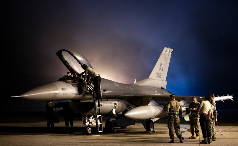 Airmen prepare a F-16 Fighting Falcon for takeoff