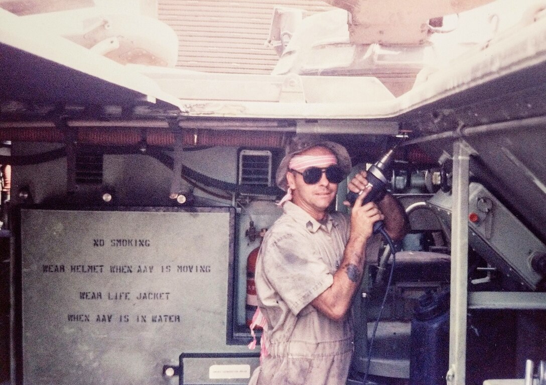Master Sgt. Tommy “TJ” Pittman repairs an Assault Amphibious Vehicle in 1991.