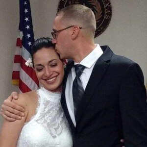 Sgt. James Green, assigned to the 1st Armored Division Mobile Command Post Operational Detachment, Texas Army National Guard, kisses his wife, Hannah, on their wedding day, May 12, 2017.