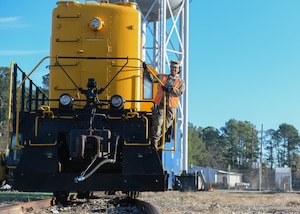 Staff Sgt. Gelisa Inniss, 628th Logistics Readiness Squadron NCO in charge of ground transportation operations center, Naval Weapons Station, stands on a locomotive at Joint Base Charleston NWS in Goose Creek, S.C., Jan. 7, 2020. Innis was the first active duty Airman to complete the Brakeman Switchman Course at Joint Base Langley-Eustis, Virginia. (U.S. Air Force photo by Senior Airman Joshua R. Maund)